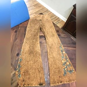 T party NWT festival bell bottoms  Rust with a floral print on the bell XL